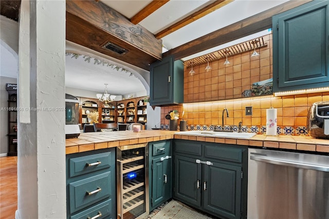 kitchen featuring tile counters, dishwasher, sink, wine cooler, and decorative backsplash