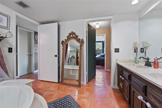 bathroom with vanity and tile patterned flooring