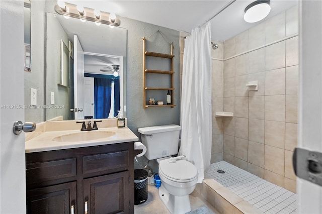 bathroom with tile patterned floors, vanity, a shower with shower curtain, and toilet