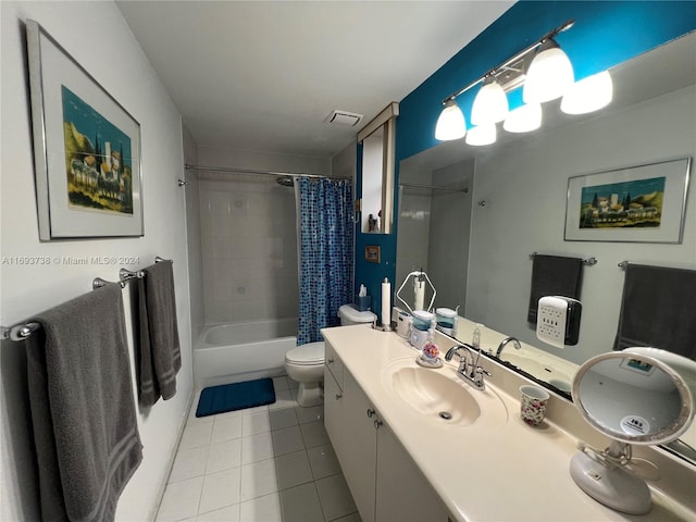 full bathroom with tile patterned flooring, vanity, toilet, and shower / bath combo with shower curtain