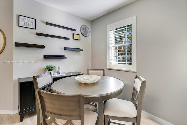 dining room with light hardwood / wood-style floors