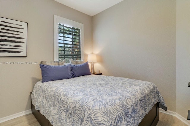 bedroom with light hardwood / wood-style floors