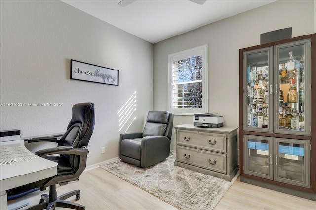 office space with light hardwood / wood-style flooring