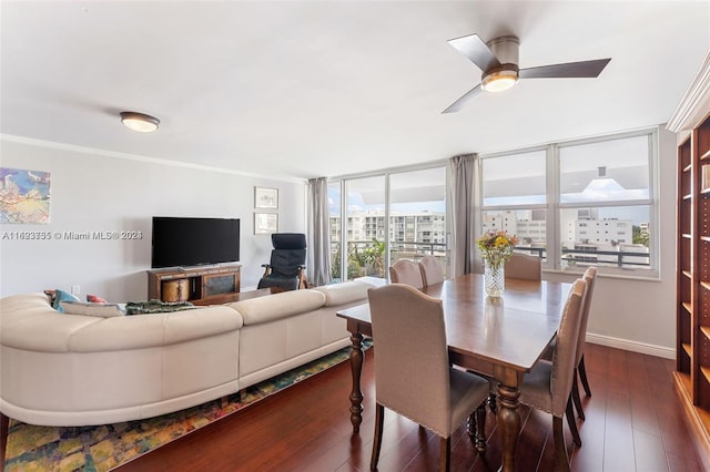 dining area with ornamental molding, expansive windows, ceiling fan, and dark wood-type flooring