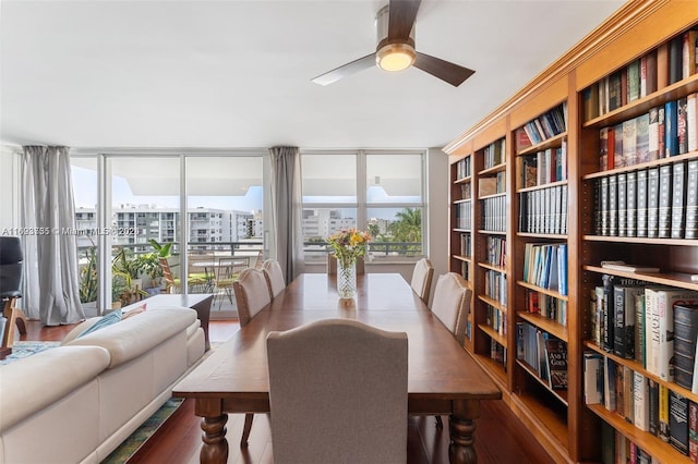 dining room with ceiling fan, hardwood / wood-style floors, and expansive windows