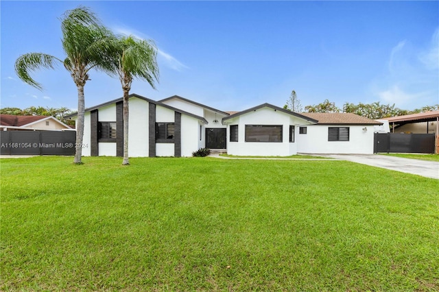 single story home featuring a front lawn