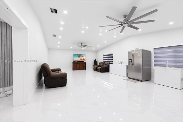 living room featuring ceiling fan and lofted ceiling