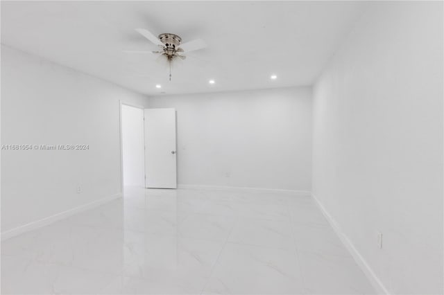 unfurnished room with ceiling fan