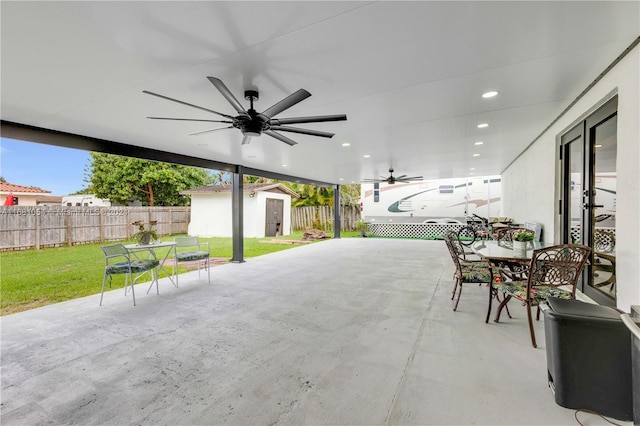 view of patio featuring a storage unit