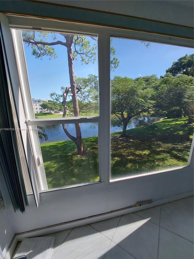 details featuring tile patterned floors and a water view