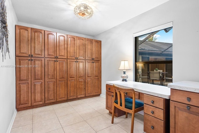 home office with light tile patterned flooring