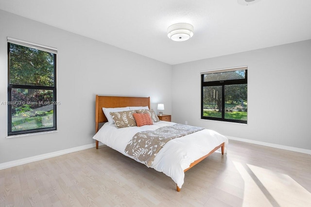 bedroom with light wood-type flooring