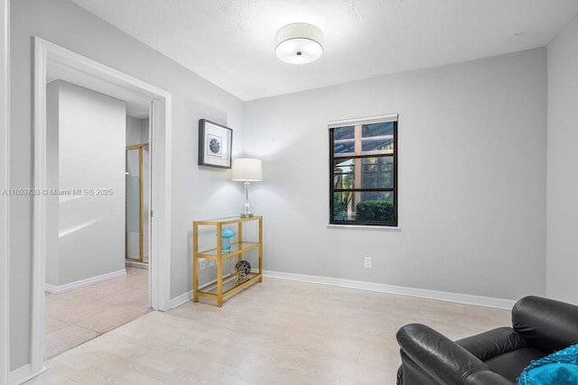 sitting room with light hardwood / wood-style flooring