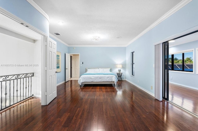 bedroom featuring crown molding and dark wood-type flooring