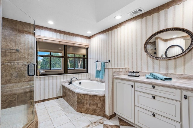 bathroom with plus walk in shower, vanity, and tile patterned floors