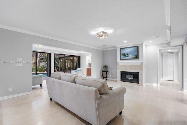 living room featuring ornamental molding and light hardwood / wood-style floors