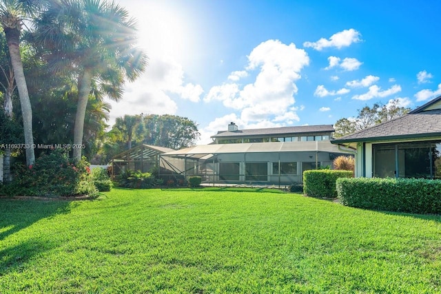 view of yard with a lanai