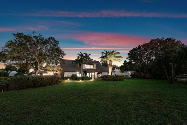 view of yard at dusk