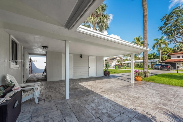 view of patio / terrace with a carport