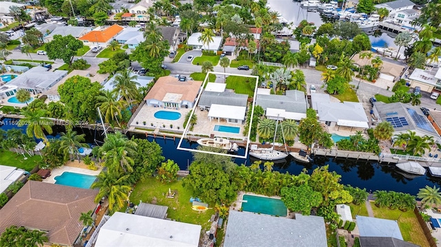 birds eye view of property with a water view