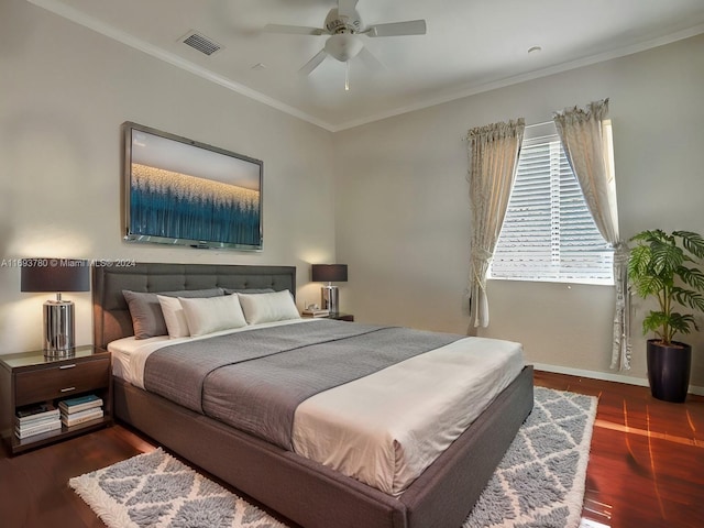 bedroom with ceiling fan, dark hardwood / wood-style flooring, and crown molding