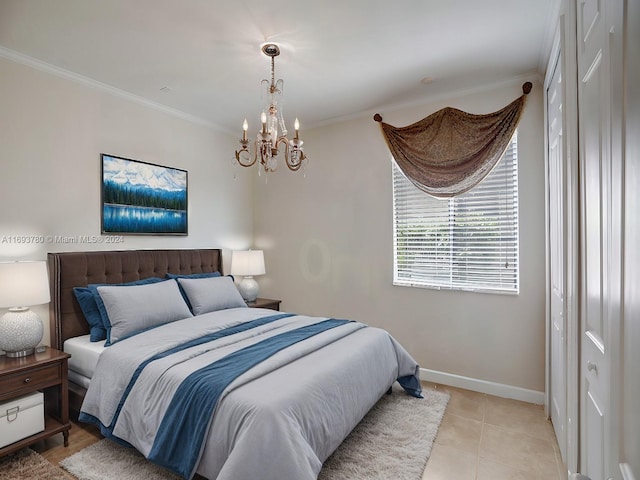 tiled bedroom with ornamental molding and a notable chandelier