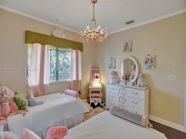 bedroom with hardwood / wood-style floors, an inviting chandelier, and crown molding