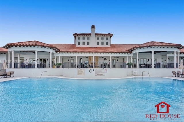 view of pool with ceiling fan and a patio area