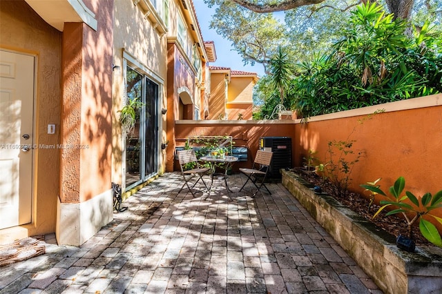 view of patio with central AC unit