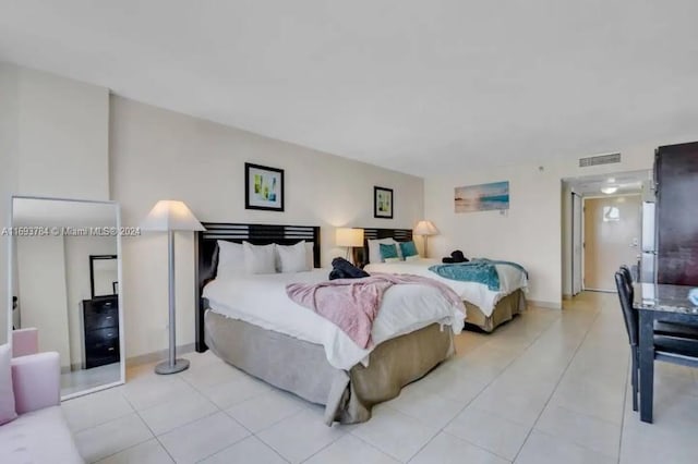 bedroom featuring light tile patterned floors