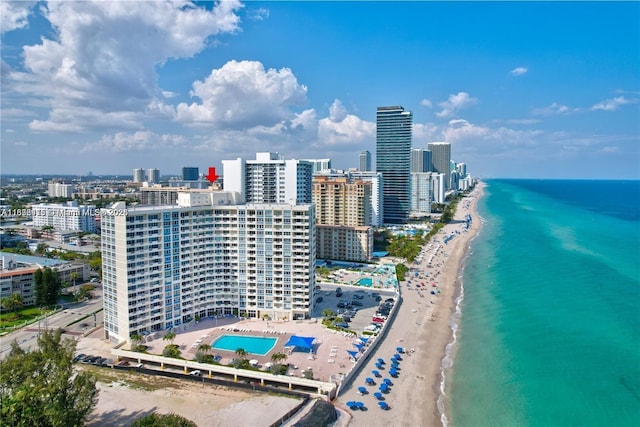 bird's eye view featuring a view of the beach and a water view