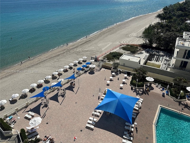 bird's eye view with a beach view and a water view