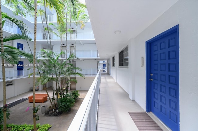 doorway to property featuring a balcony