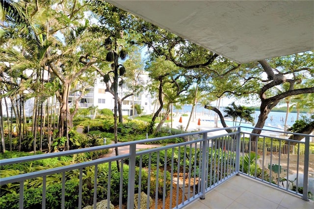 balcony featuring a water view