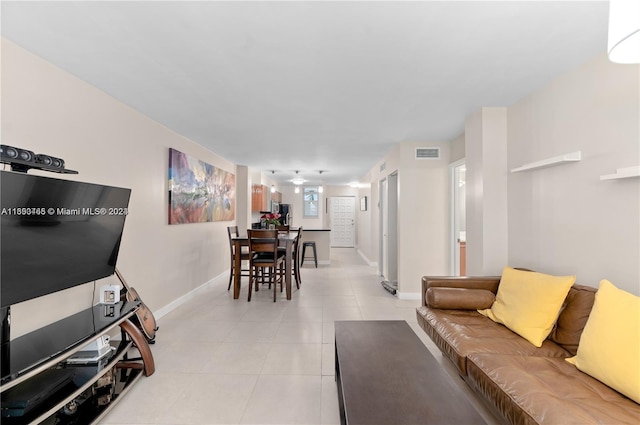 living room with light tile patterned floors