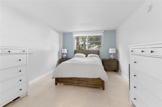 bedroom with light tile patterned flooring