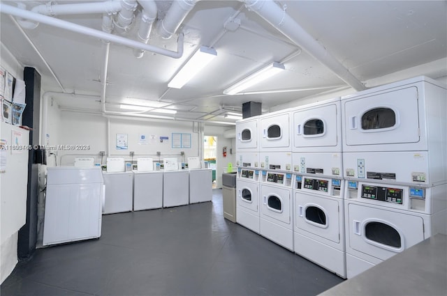 clothes washing area featuring separate washer and dryer and stacked washer / drying machine