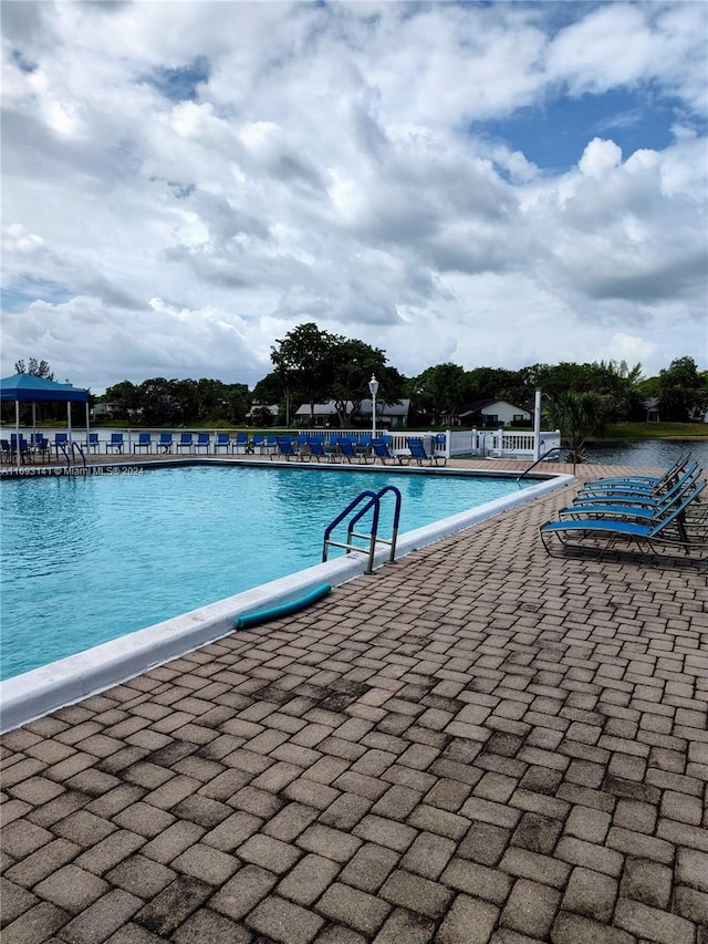 view of swimming pool with a patio