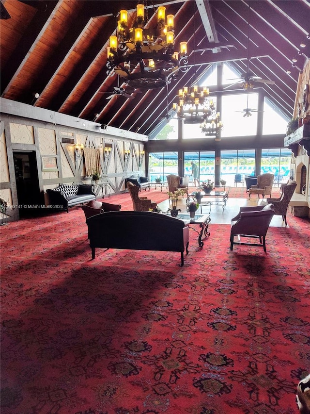 carpeted living room with beam ceiling, high vaulted ceiling, a wealth of natural light, and ceiling fan