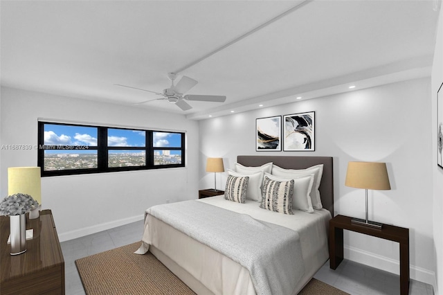 bedroom with ceiling fan and light tile patterned flooring