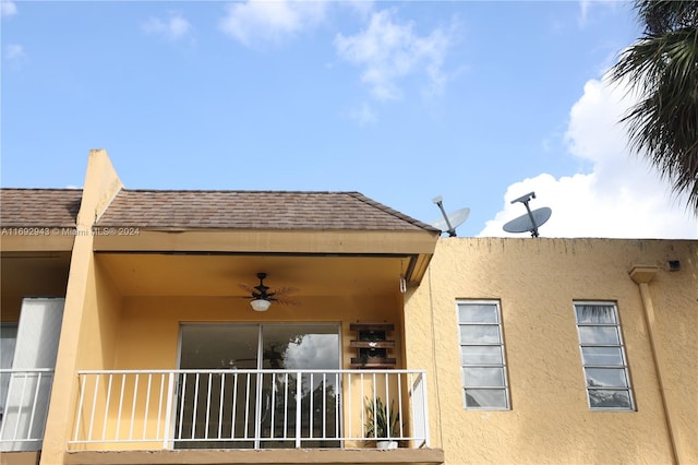 view of side of home with ceiling fan