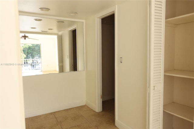 hallway with light tile patterned floors