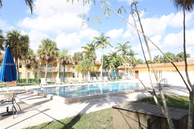 view of swimming pool featuring a patio area