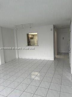 spare room with light tile patterned floors