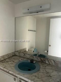 kitchen with stainless steel dishwasher, light tile patterned floors, sink, and white electric stovetop