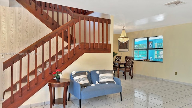 stairway featuring tile patterned floors and a notable chandelier