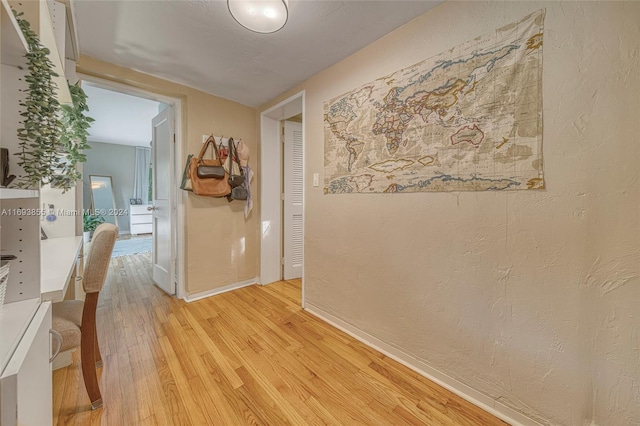 corridor featuring light hardwood / wood-style flooring