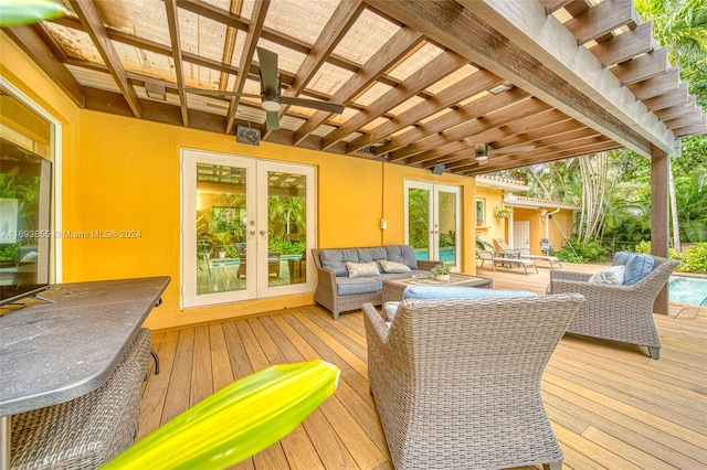 deck with ceiling fan, french doors, and an outdoor hangout area