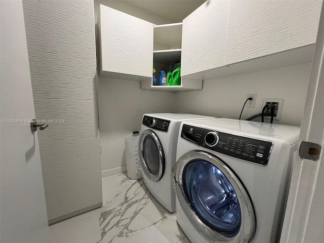 clothes washing area featuring washing machine and clothes dryer