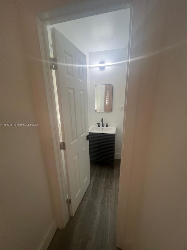 bathroom featuring vanity and hardwood / wood-style flooring